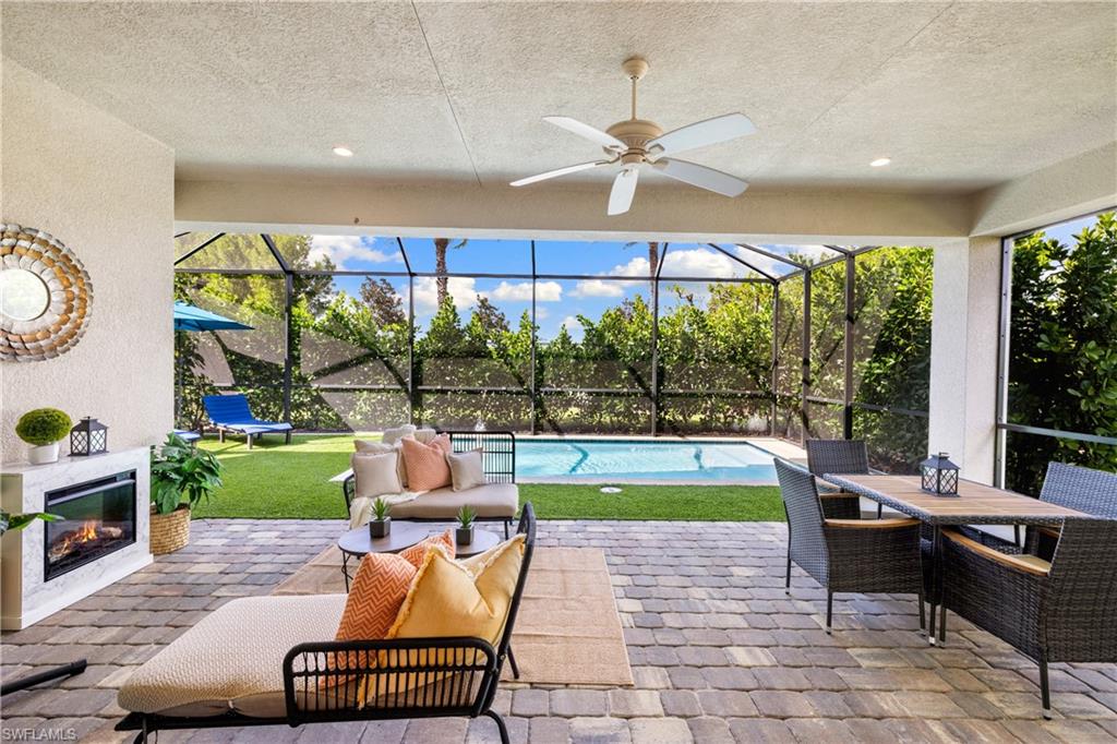 10137 Florence Circle Naples, FL 34119 - Photo 28 of 42 a room with furniture and a large window
