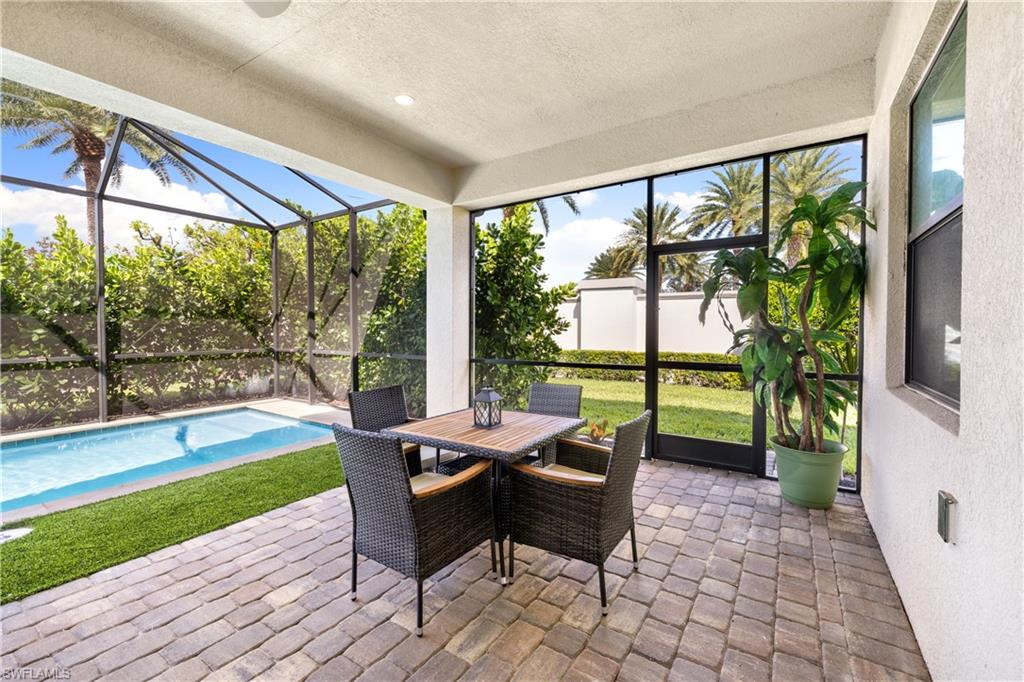 10137 Florence Circle Naples, FL 34119 - Photo 29 of 42 a outdoor space with chairs