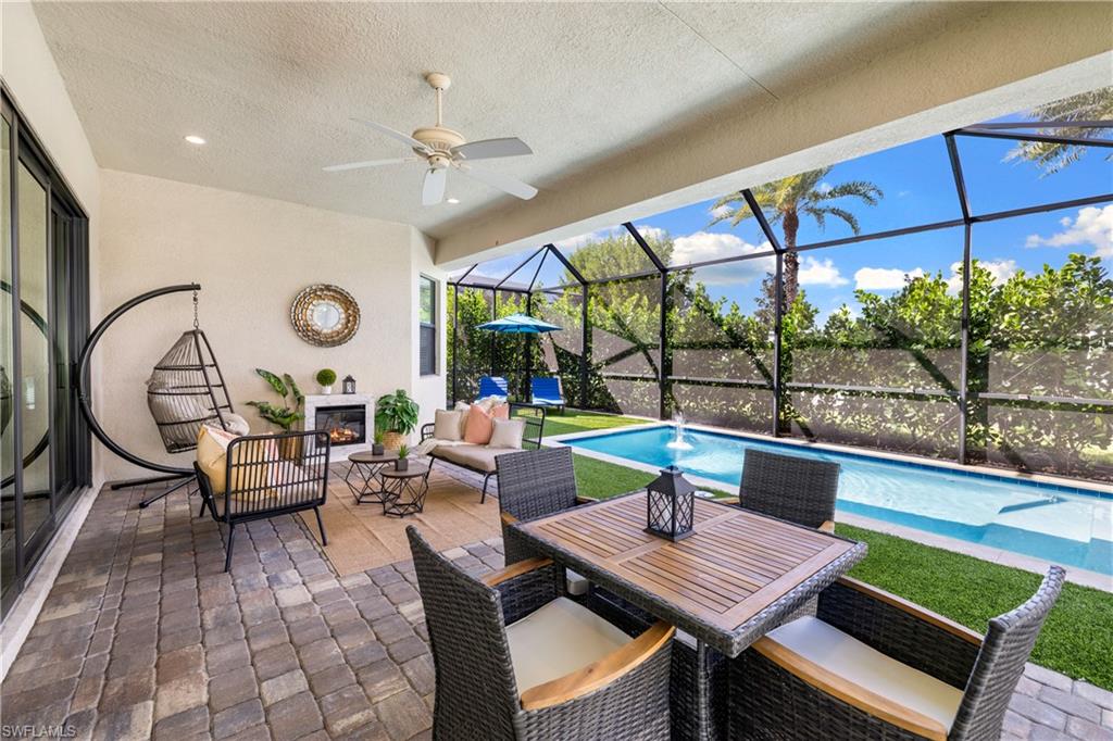 10137 Florence Circle Naples, FL 34119 - Photo 30 of 42 a living room with lots of furniture and a large window