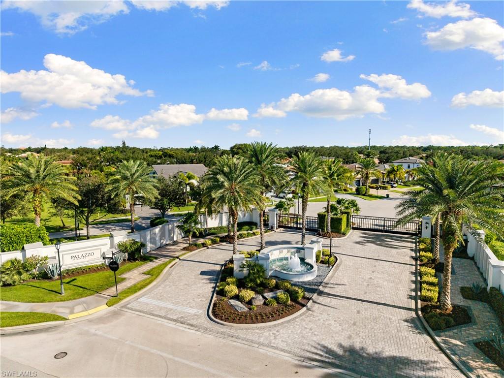 10137 Florence Circle Naples, FL 34119 - Photo 42 of 42 a view of a swimming pool and lounge chair