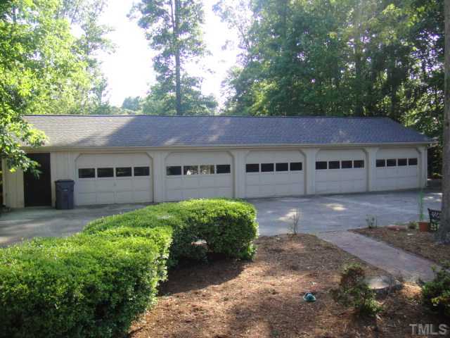 3100 Auburn Knightdale Road Raleigh, NC 27610 - Photo 4 of 25 This spacious Five Car Garage has a storage room behind the dark brown door left and the 1st bay has a workshop area, too!