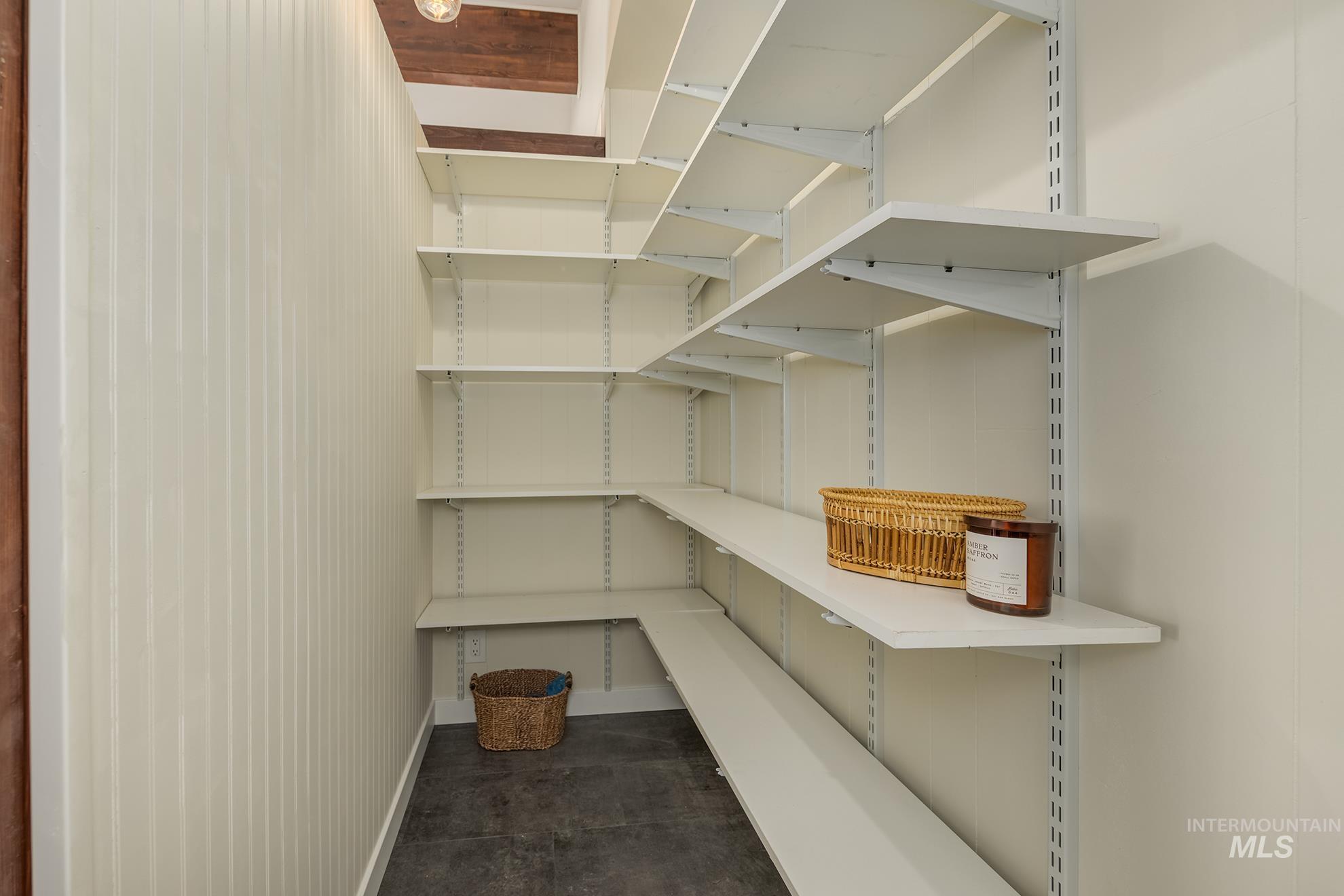 748 Pringle Road Weiser, ID 83672 - Photo 12 of 47 Adjustable wall-mounted shelving system featuring multiple white shelves