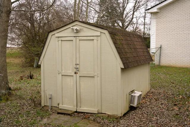 a front view of a house with parking area