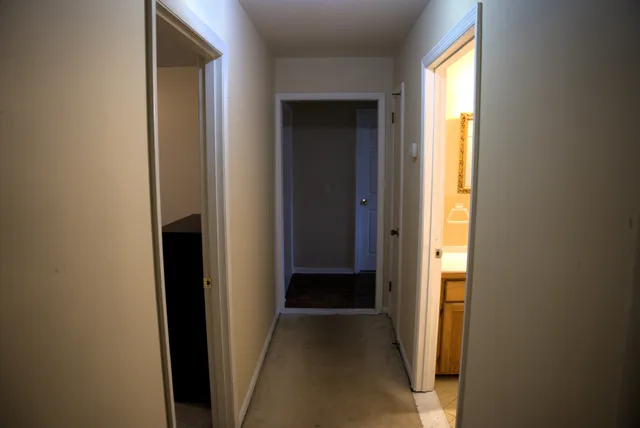 a view of a hallway with windows