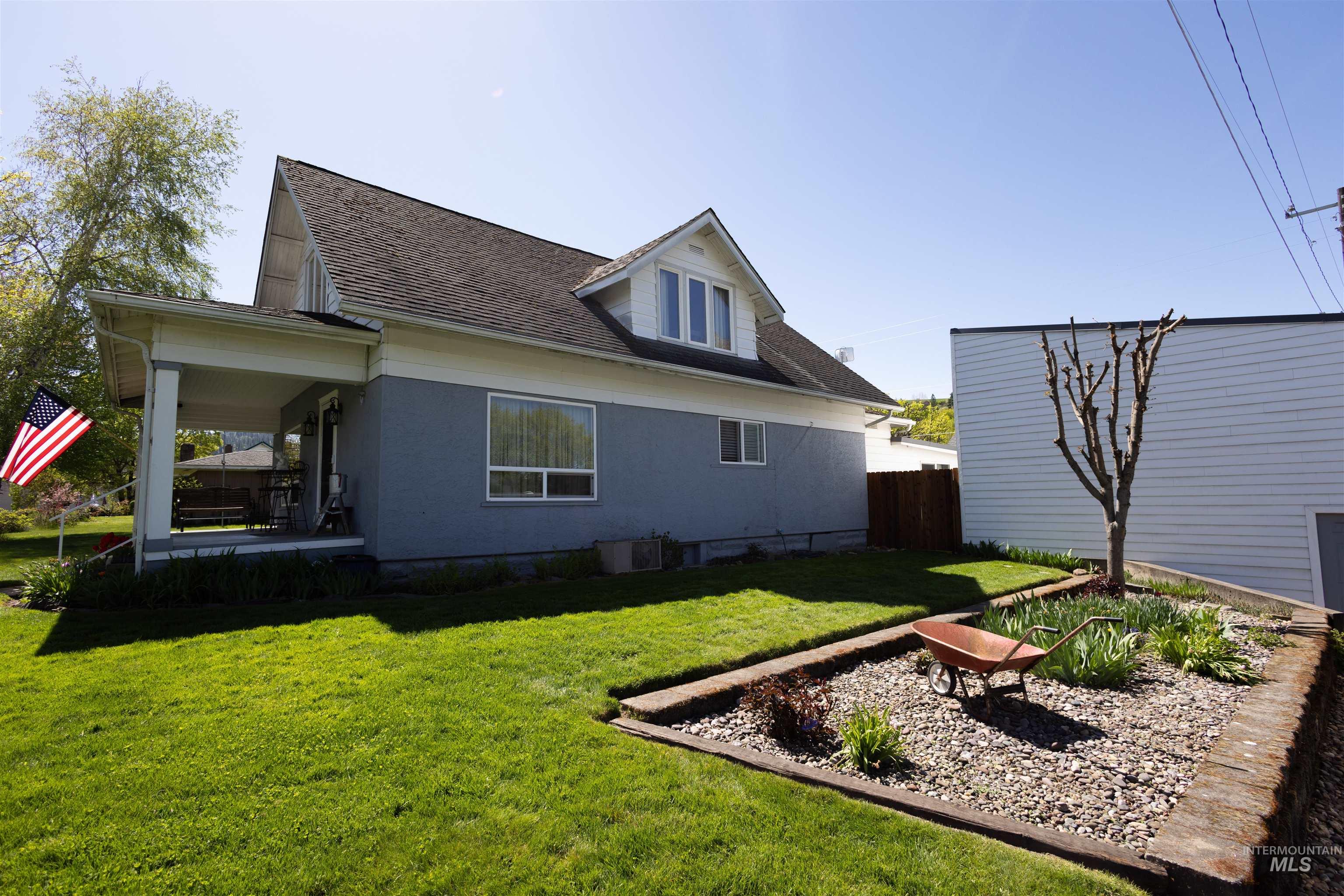 804 Maple Street Kamiah, ID 83536 - Photo 32 of 50 Exterior facade featuring a covered porch, dormer window, and a gabled roofline