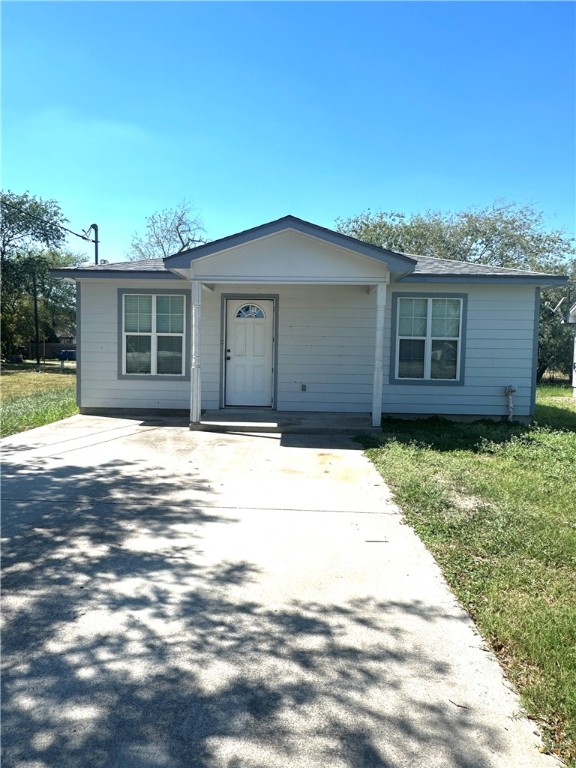 a house view with a backyard space
