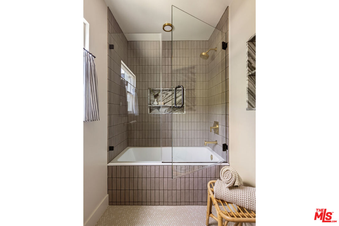 3031 Virginia Road Los Angeles, CA 90016 - Photo 5 of 10 a bathroom with a tub and shower
