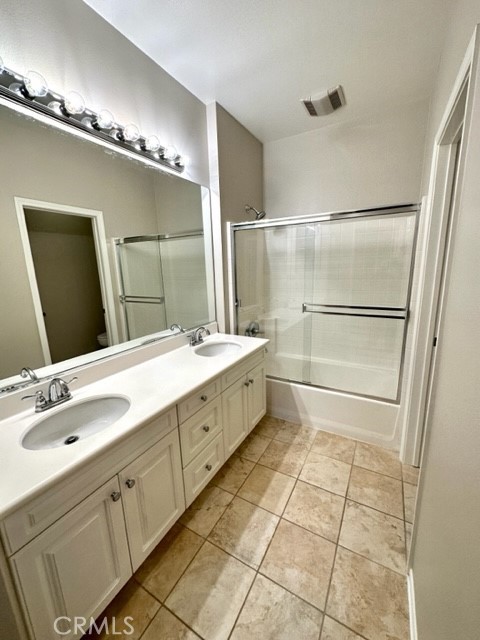 10 Paseo Rosa San Clemente, CA 92673 - Photo 15 of 46 a bathroom with a double vanity sink a mirror and a shower