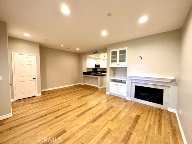 10 Paseo Rosa San Clemente, CA 92673 - Photo 8 of 46 a view of empty room with kitchen and fireplace