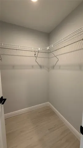 a view of a room with racks on the wall