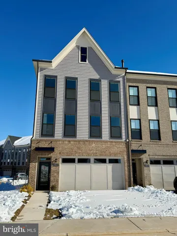 a kitchen with granite countertop a sink a stove and cabinets