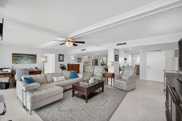 a view of a dining room with furniture large windows and wooden floor