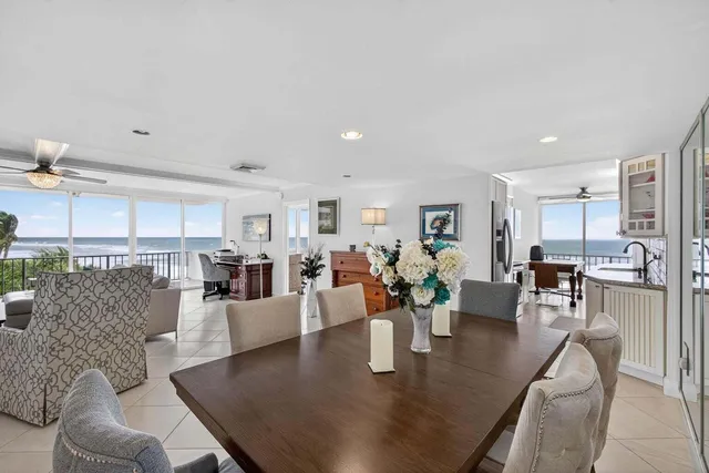 a living room with furniture and large windows