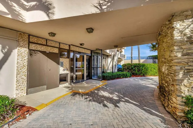 a kitchen with a stove a sink and a microwave