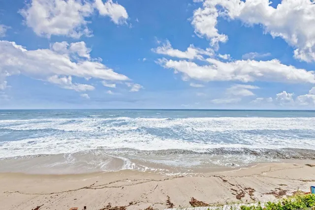 a bedroom with a large bed and a large window