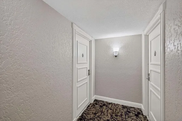 a view of a room with furniture and a window