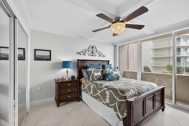 a living room with furniture and large windows