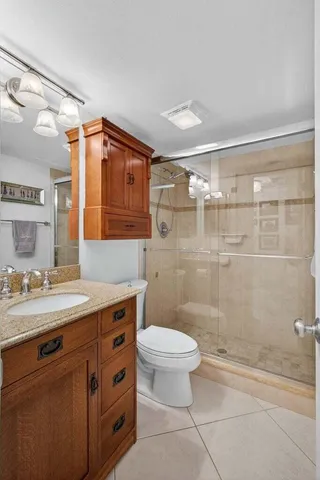 a bedroom with a bed and ceiling fan