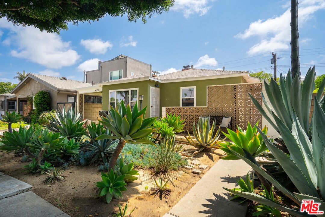 4367 Globe Avenue Culver City, CA 90230 - Photo 1 of 34 a front view of a house with a garden