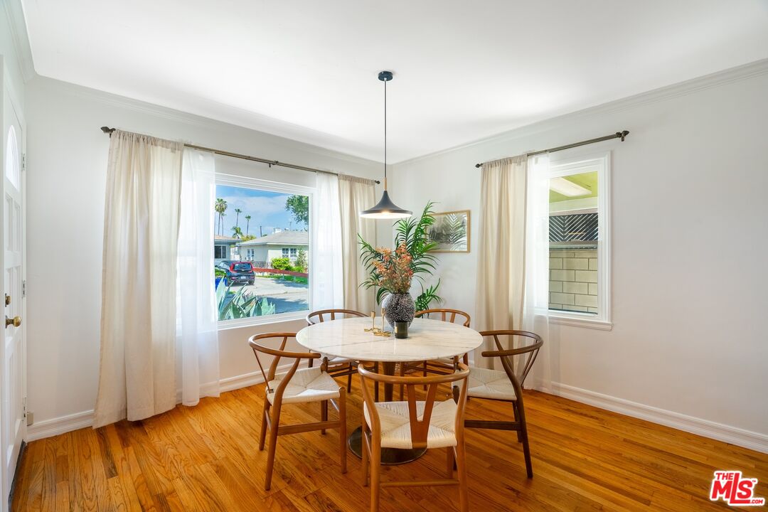 4367 Globe Avenue Culver City, CA 90230 - Photo 11 of 34 a dining room with furniture window wooden floor