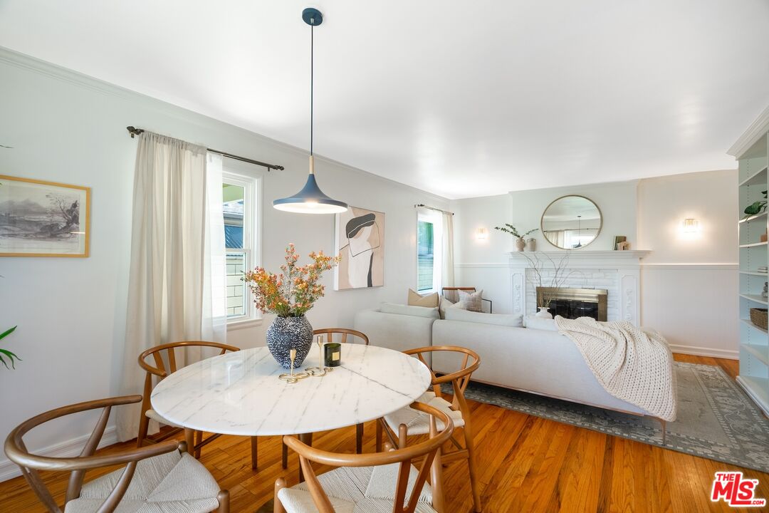 4367 Globe Avenue Culver City, CA 90230 - Photo 12 of 34 a living room with furniture a fireplace and a chandelier