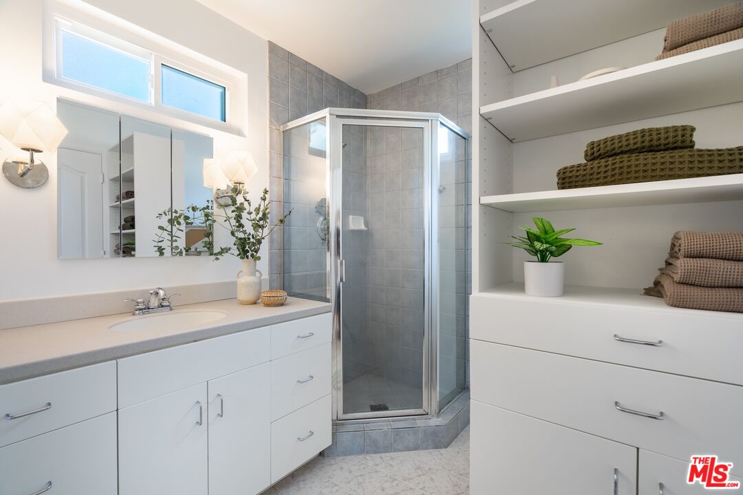 4367 Globe Avenue Culver City, CA 90230 - Photo 16 of 34 a bathroom with a double vanity sink and shower