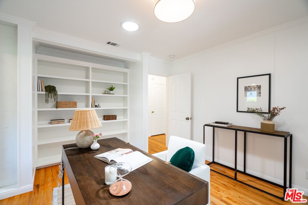 4367 Globe Avenue Culver City, CA 90230 - Photo 17 of 34 a living room with furniture and a wooden floor