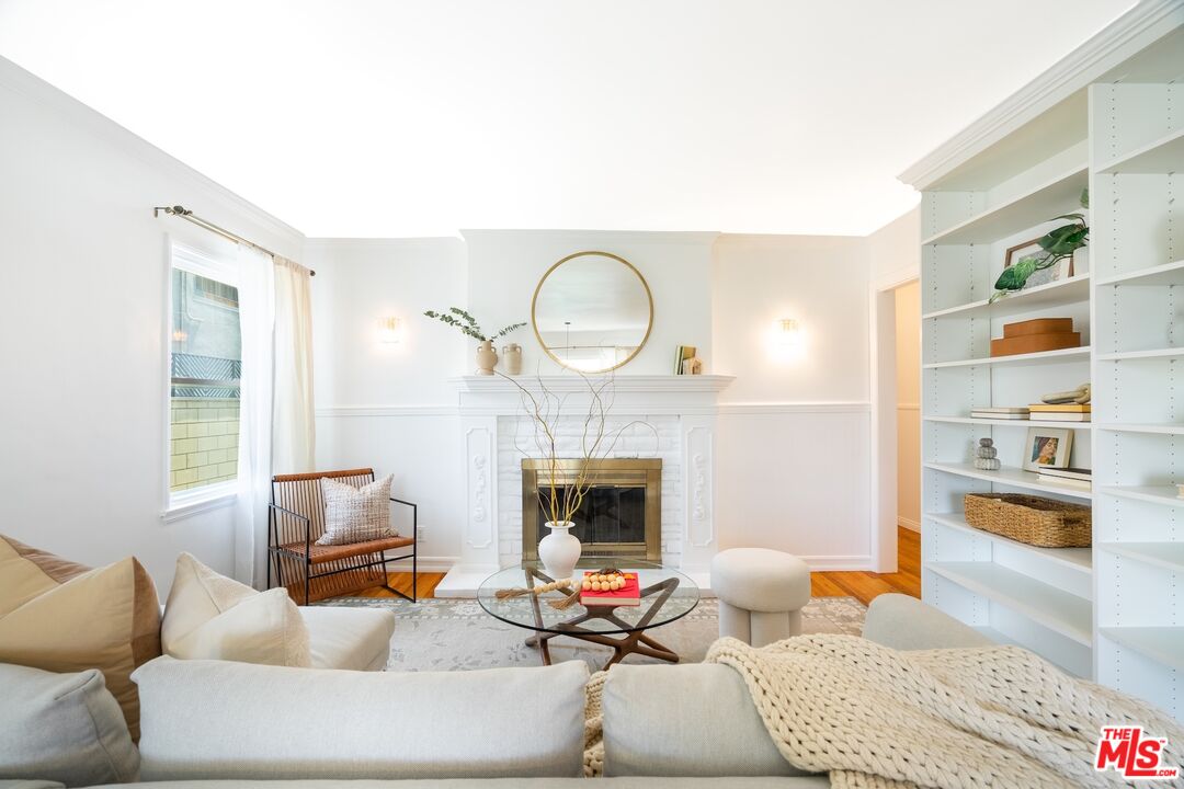 4367 Globe Avenue Culver City, CA 90230 - Photo 2 of 34 a living room with furniture fireplace and a fireplace