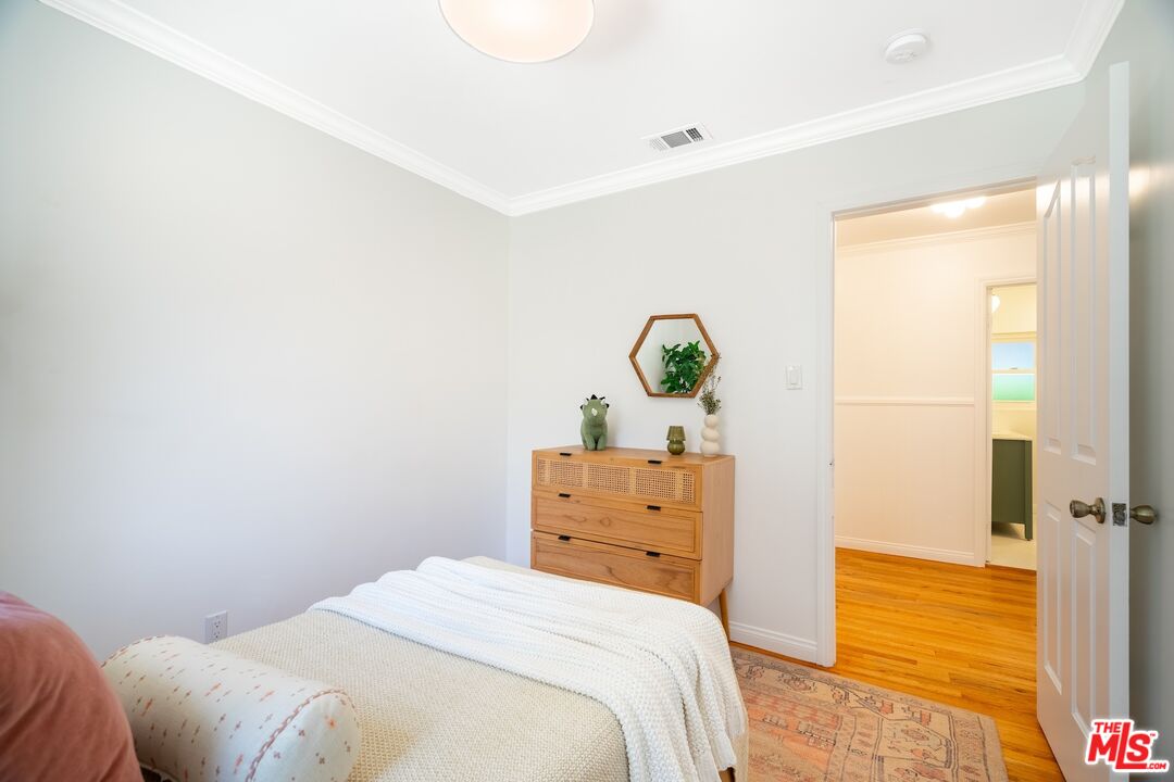 4367 Globe Avenue Culver City, CA 90230 - Photo 21 of 34 a bedroom with a bed and a dresser
