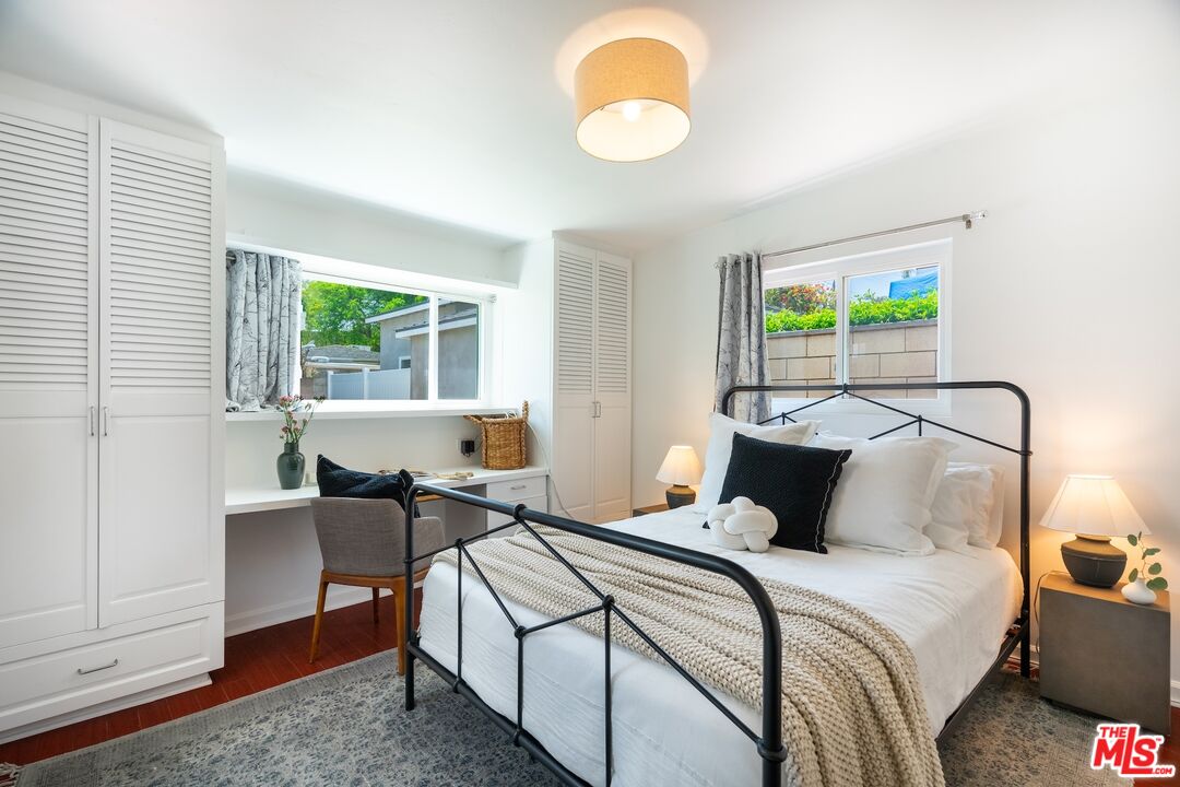 4367 Globe Avenue Culver City, CA 90230 - Photo 22 of 34 a bedroom with a bed and wooden floor
