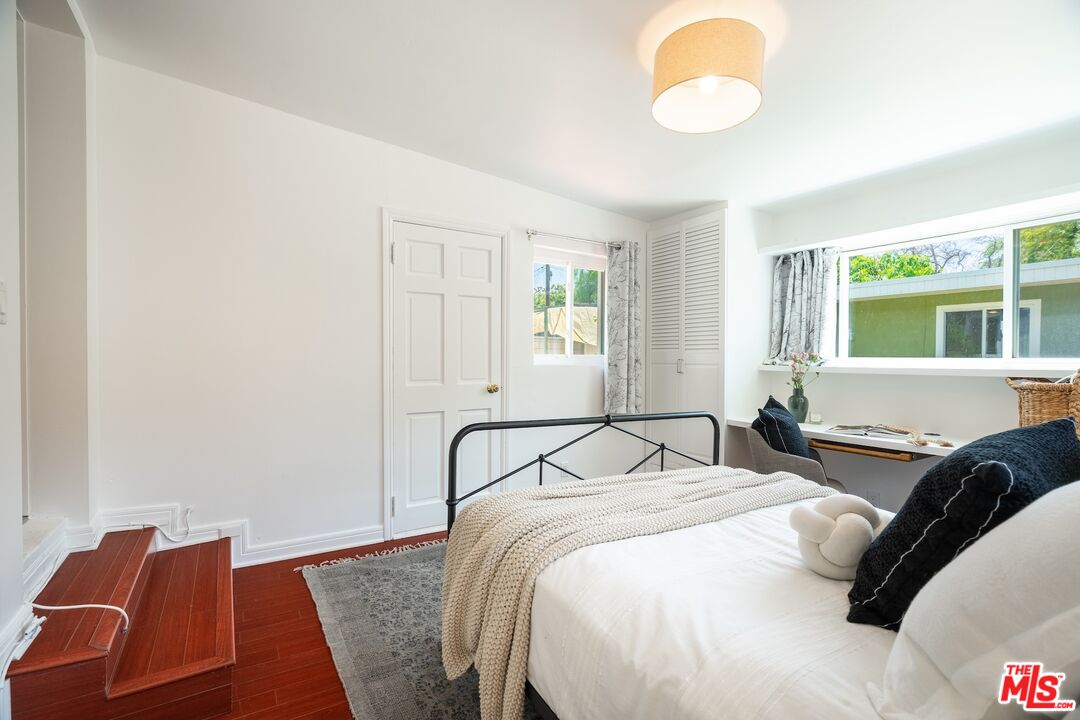 4367 Globe Avenue Culver City, CA 90230 - Photo 23 of 34 a bedroom with a bed and wooden floor