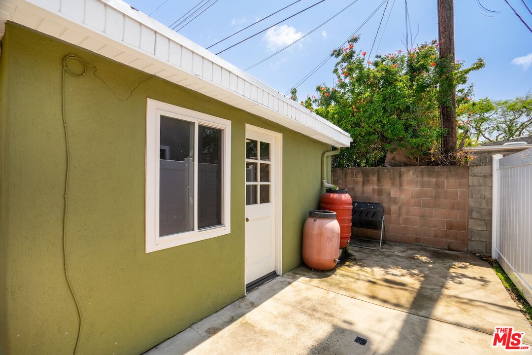 4367 Globe Avenue Culver City, CA 90230 - Photo 30 of 34 a view of a porch with a table and chairs and potted plants