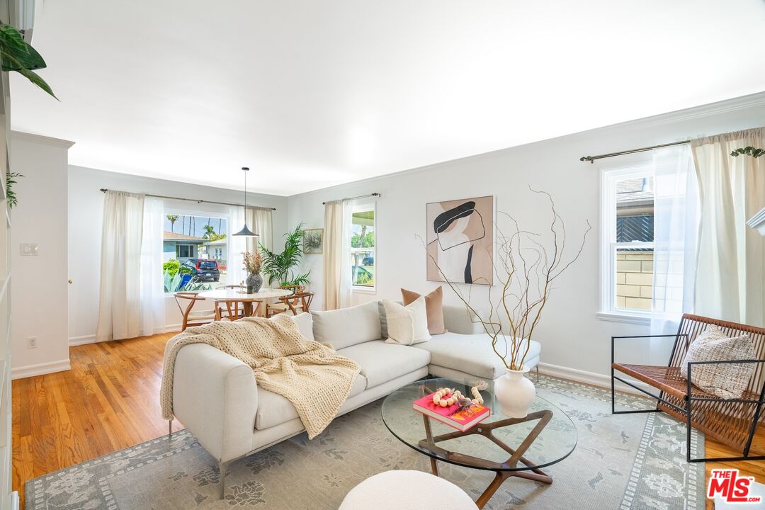 4367 Globe Avenue Culver City, CA 90230 - Photo 4 of 34 a living room with furniture and a large window