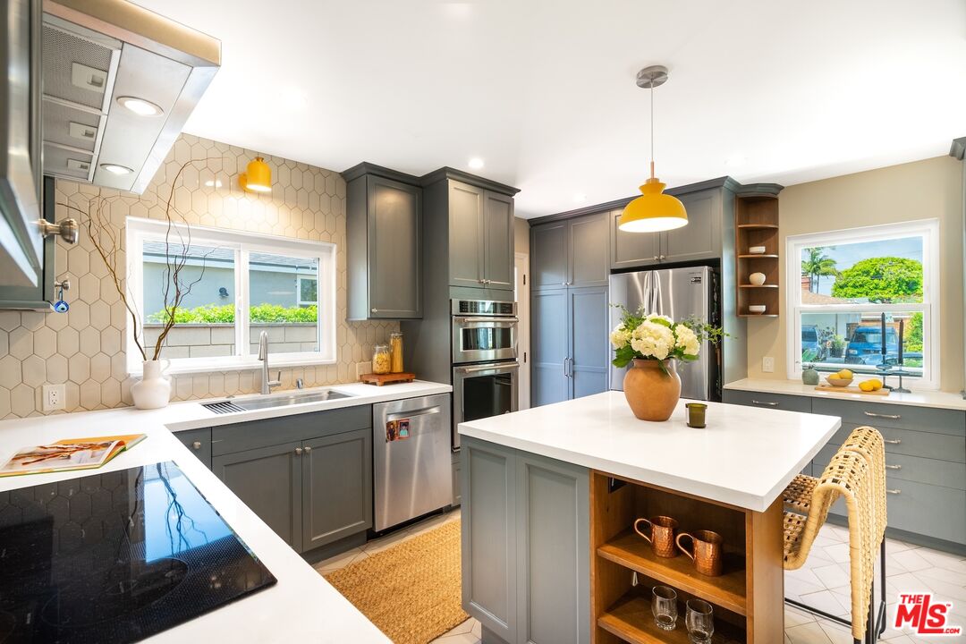 4367 Globe Avenue Culver City, CA 90230 - Photo 6 of 34 a kitchen with a sink cabinets and window