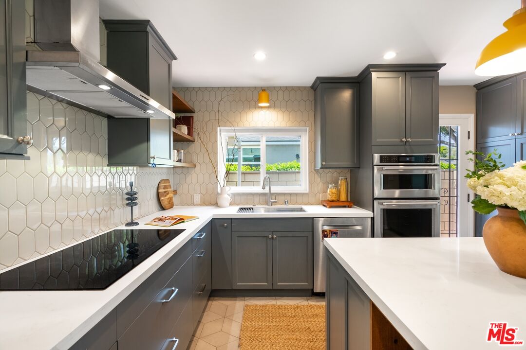 4367 Globe Avenue Culver City, CA 90230 - Photo 9 of 34 a kitchen with a sink a stove and cabinets