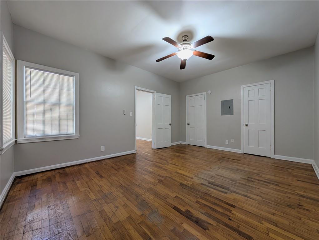 3548 East Main Street, Unit 2 Atlanta, GA 30337 - Photo 9 of 13 a view of an empty room with wooden floor and a window