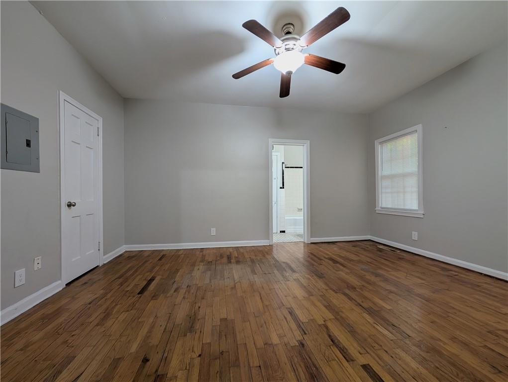 3548 East Main Street, Unit 2 Atlanta, GA 30337 - Photo 10 of 13 an empty room with wooden floor and windows