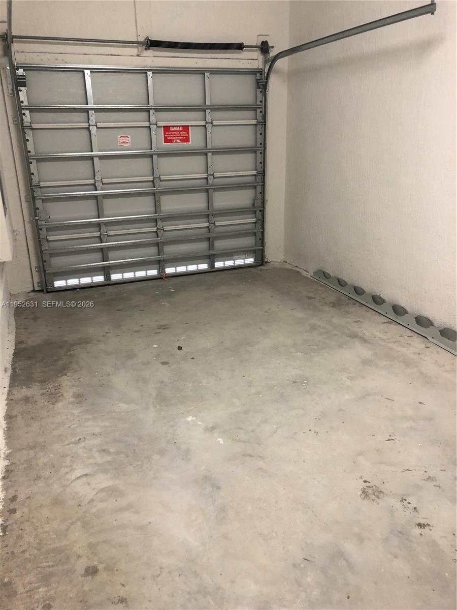 2610 Southeast 13th Street Homestead, FL 33035 - Photo 16 of 24 a view of a room with an empty racks