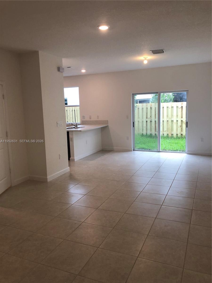 2610 Southeast 13th Street Homestead, FL 33035 - Photo 2 of 24 a view of an empty room with a window