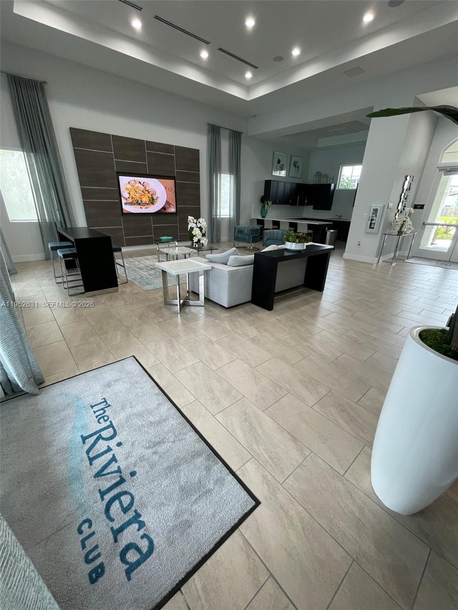 2610 Southeast 13th Street Homestead, FL 33035 - Photo 22 of 24 a lobby with furniture and a flat screen tv