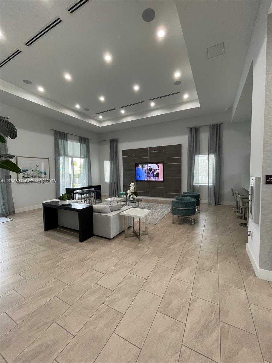 2610 Southeast 13th Street Homestead, FL 33035 - Photo 23 of 24 a lobby with furniture and a flat screen tv