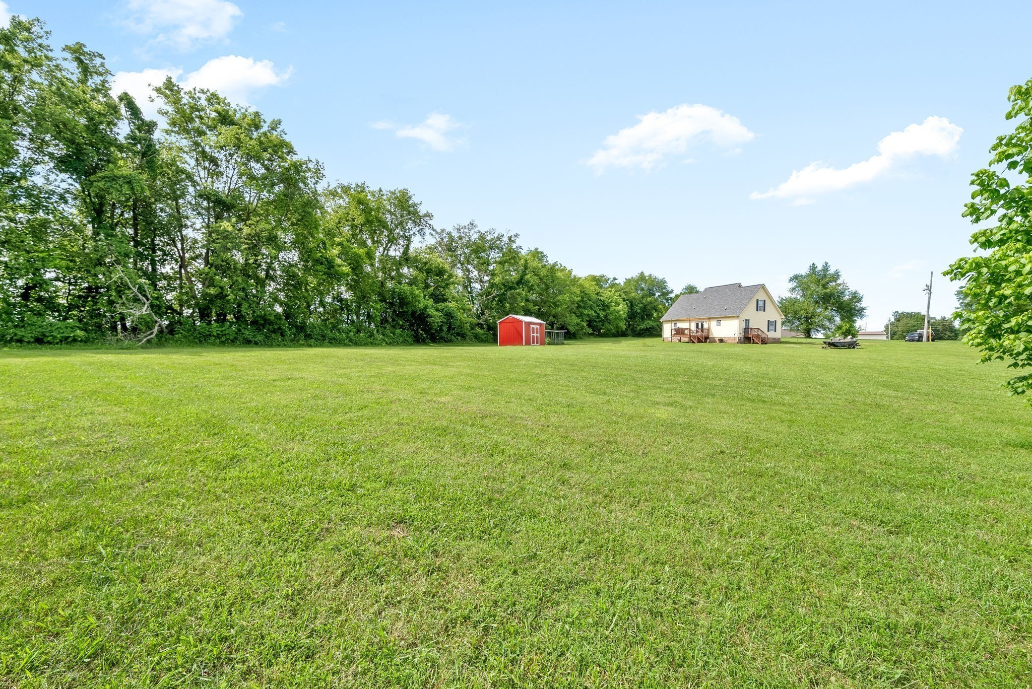 6417 Highway 25 Springfield, TN 37172 - Photo 2 of 43 a view of a field of grass and trees
