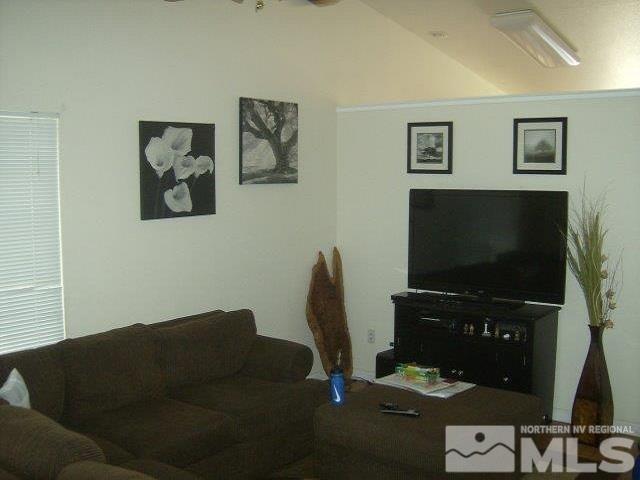 17805 Fortune Court Reno, NV 89508 - Photo 6 of 8 a living room with furniture and a flat screen tv