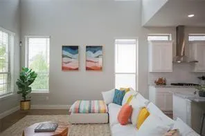 a living room with furniture and a potted plant
