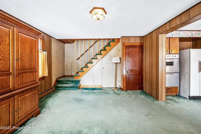 a kitchen with stainless steel appliances a refrigerator and a stove