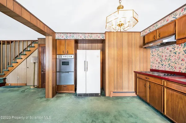 a view of room with window and wooden floor