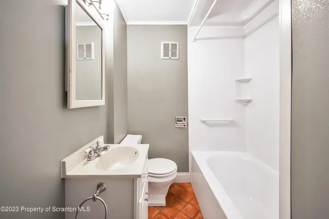 a bathroom with a sink a mirror and a bathtub