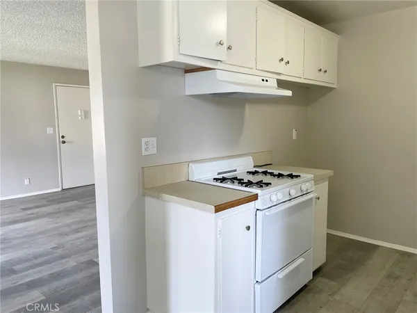 a kitchen with a stove and a microwave