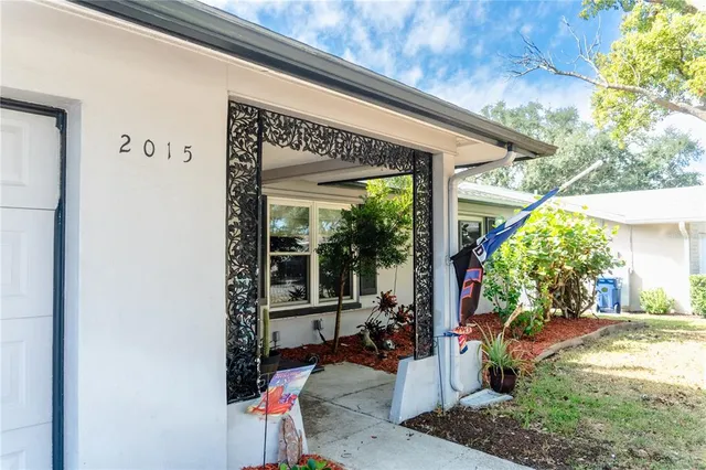 a view of a patio with table and chairs potted plants