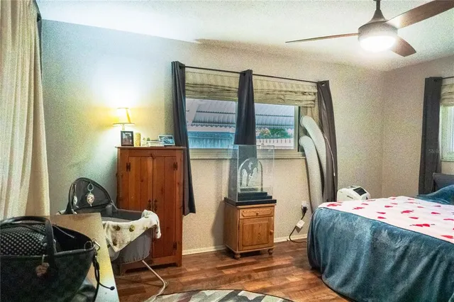 a bedroom with a bed and a desk